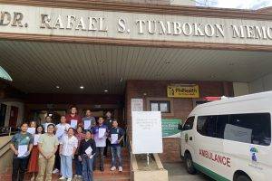group photo of dietary personnel of Dr. Rafael S. Tumbokon Memorial Hospital holding their basic food safety for food handler certificate