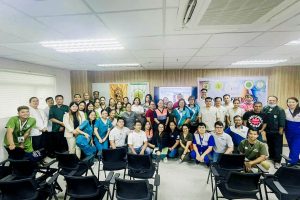 Hospital personnel taking a group picture after the food safety training