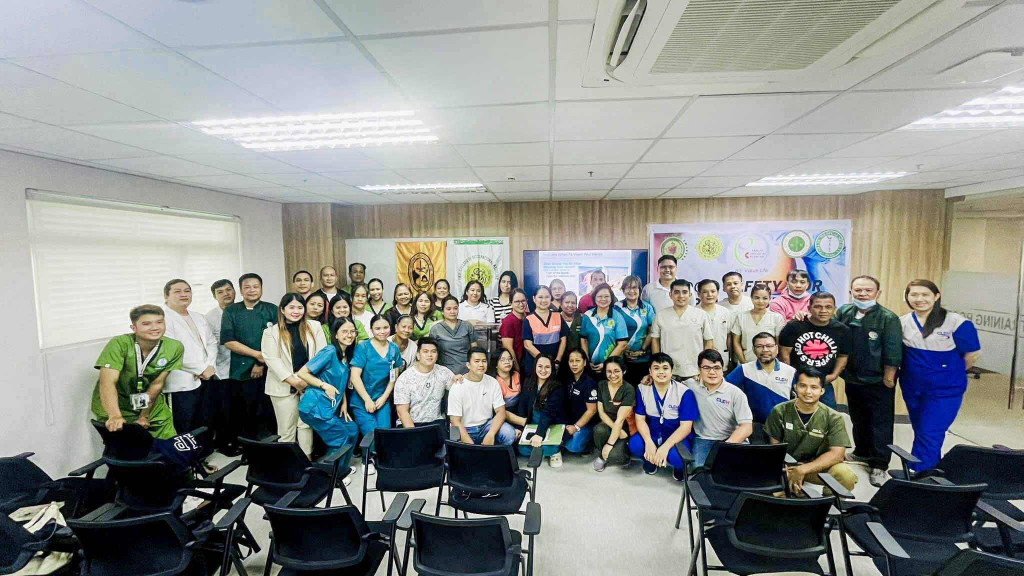 Hospital personnel taking a group picture after the food safety training