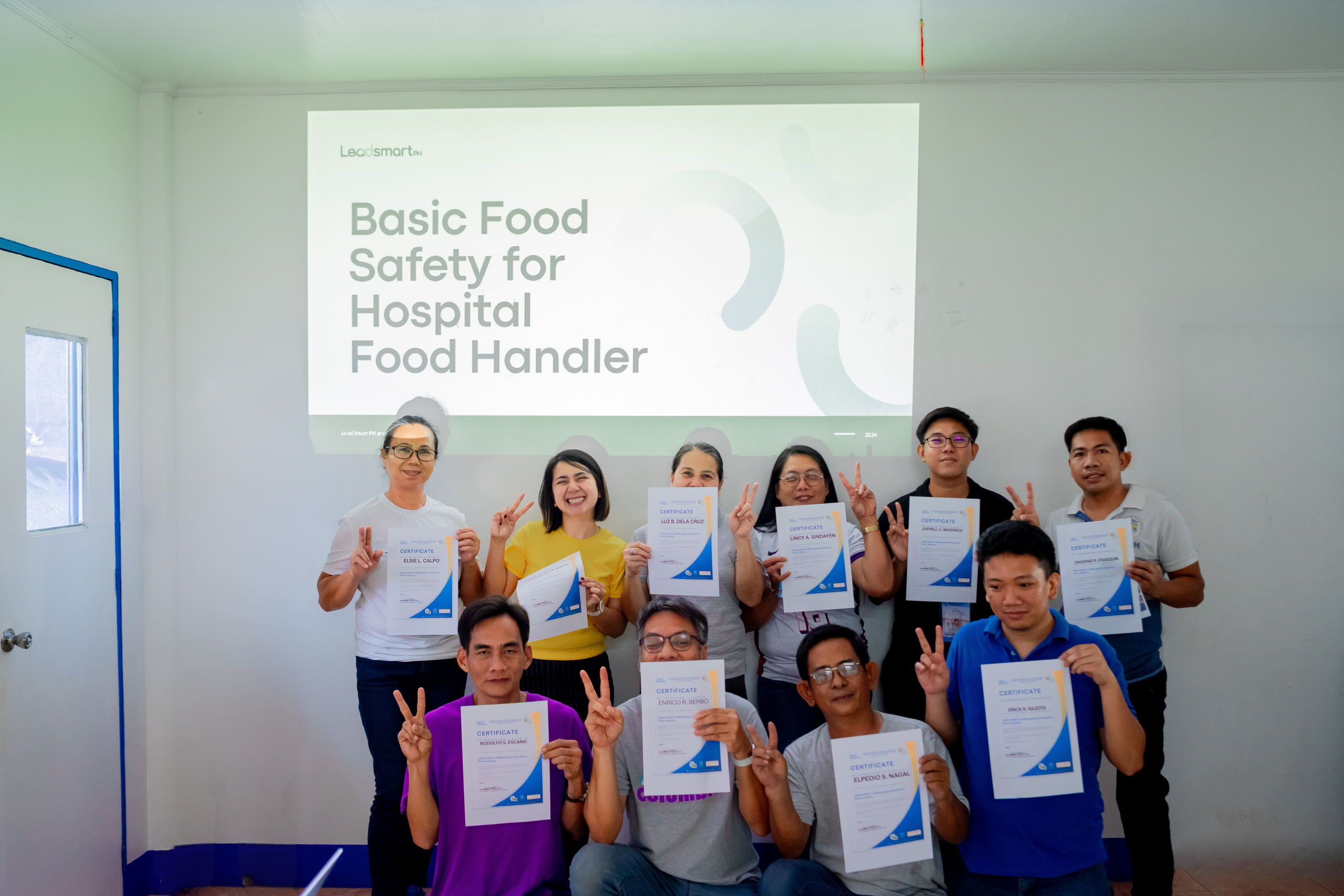 Ms. Jasmine Faith Bernal, RND, and the dietary staff of Western Pangasinan District Hospital proudly displaying their newly earned food hygiene and handling certificate after comprehensive training. New Food Hygiene and Handling Certificate